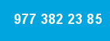 977 382 23 85